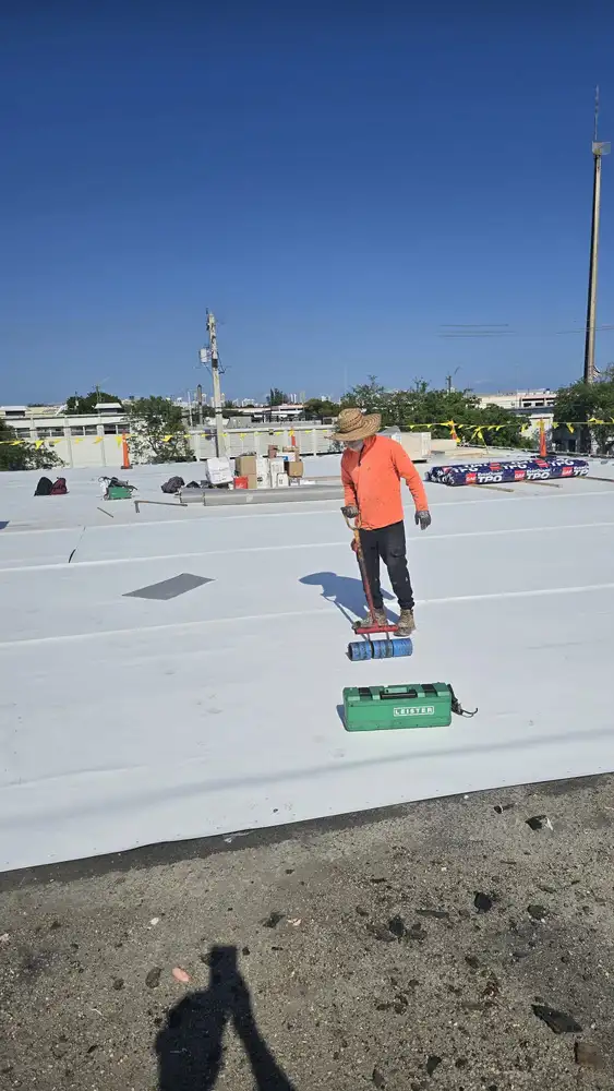 People working in a Flat / TPO Roof